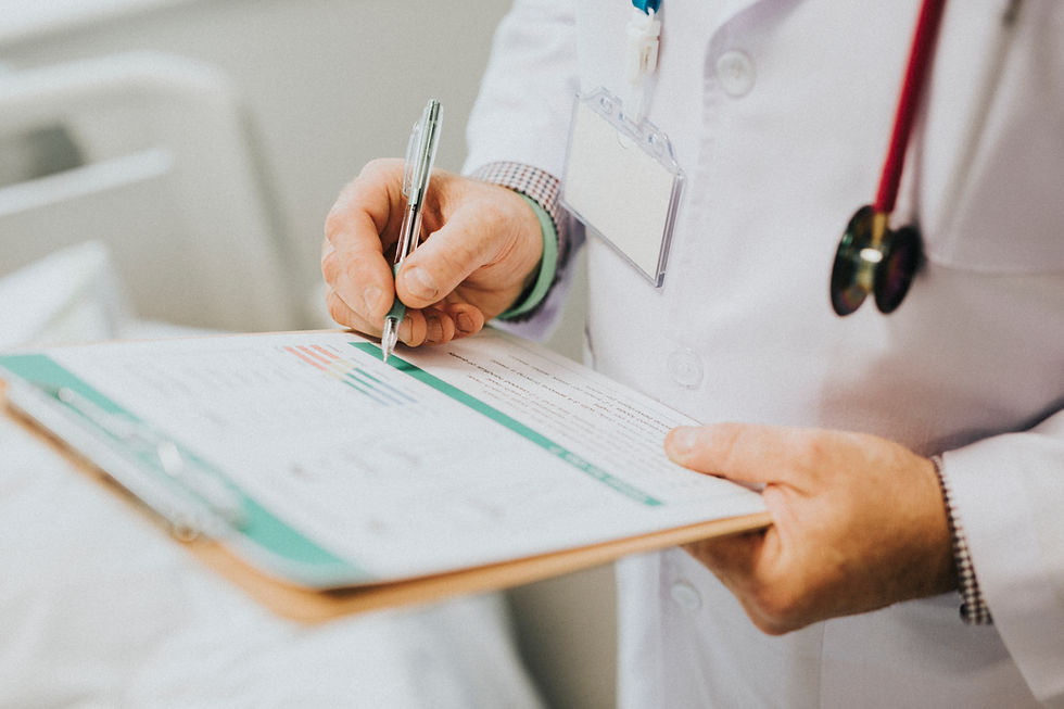 physician-noting-down-symptoms-patient.jpg