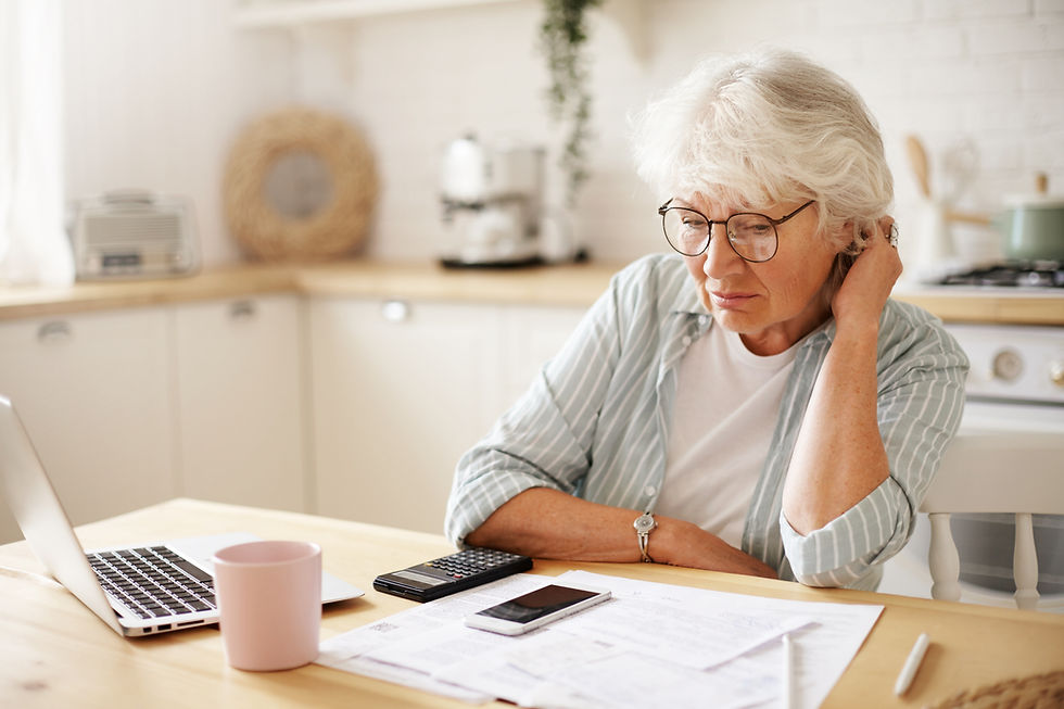 people-age-technology-finances-depressed-unhappy-retired-woman-paying-domestic-bills-onlin