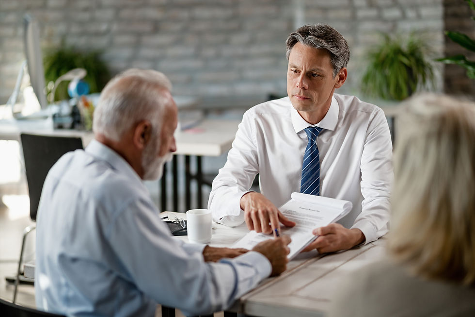 insurance-agent-having-meeting-with-senior-clients-pointing-place-signature-contract.jpg