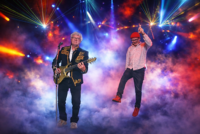 Concert énergique sous des lumières colorées.png