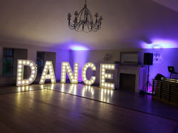 KMS Hire illuminated DANCE letters