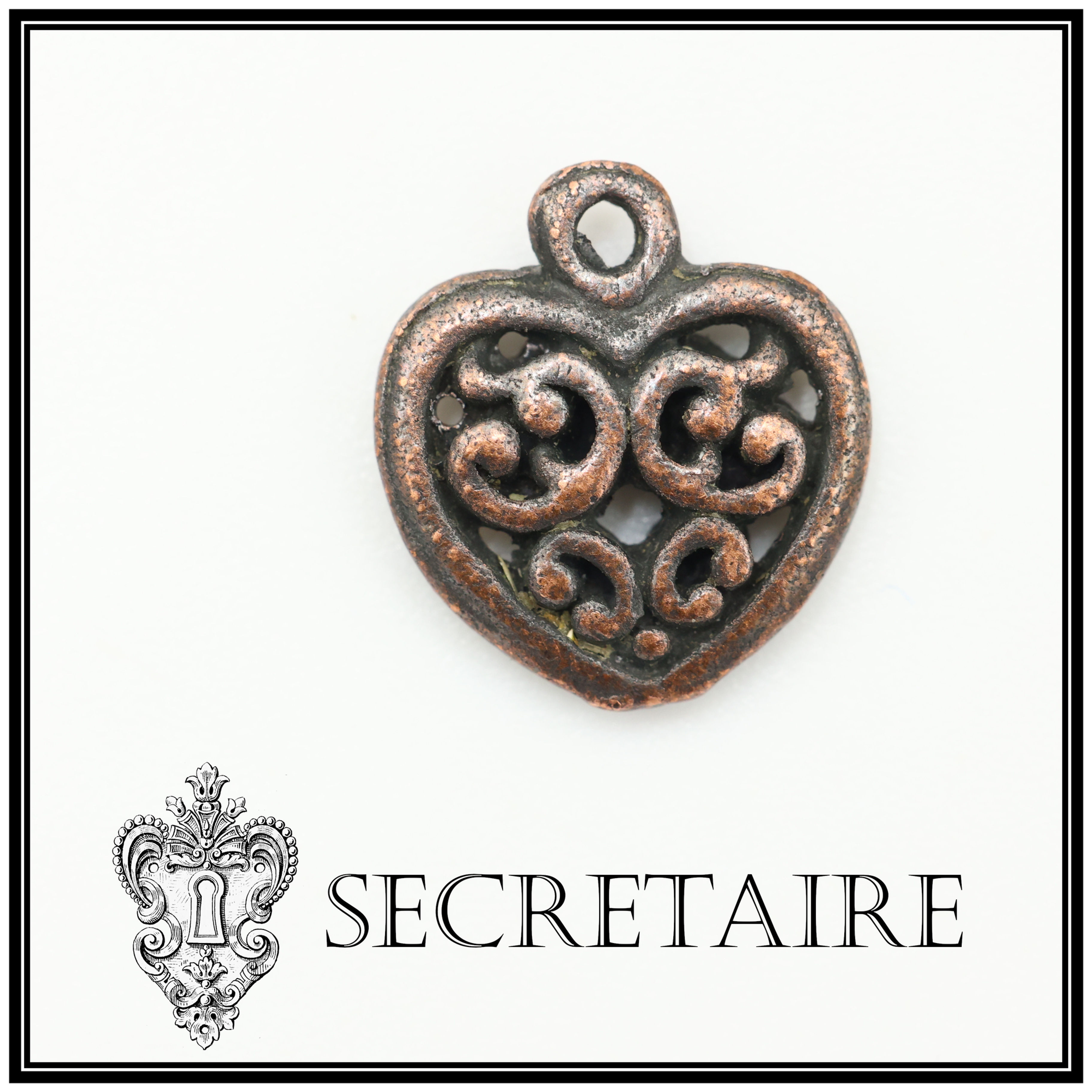 Charm: Patterned heart in antique bronze colour. Size: 1.3 cm [G12]