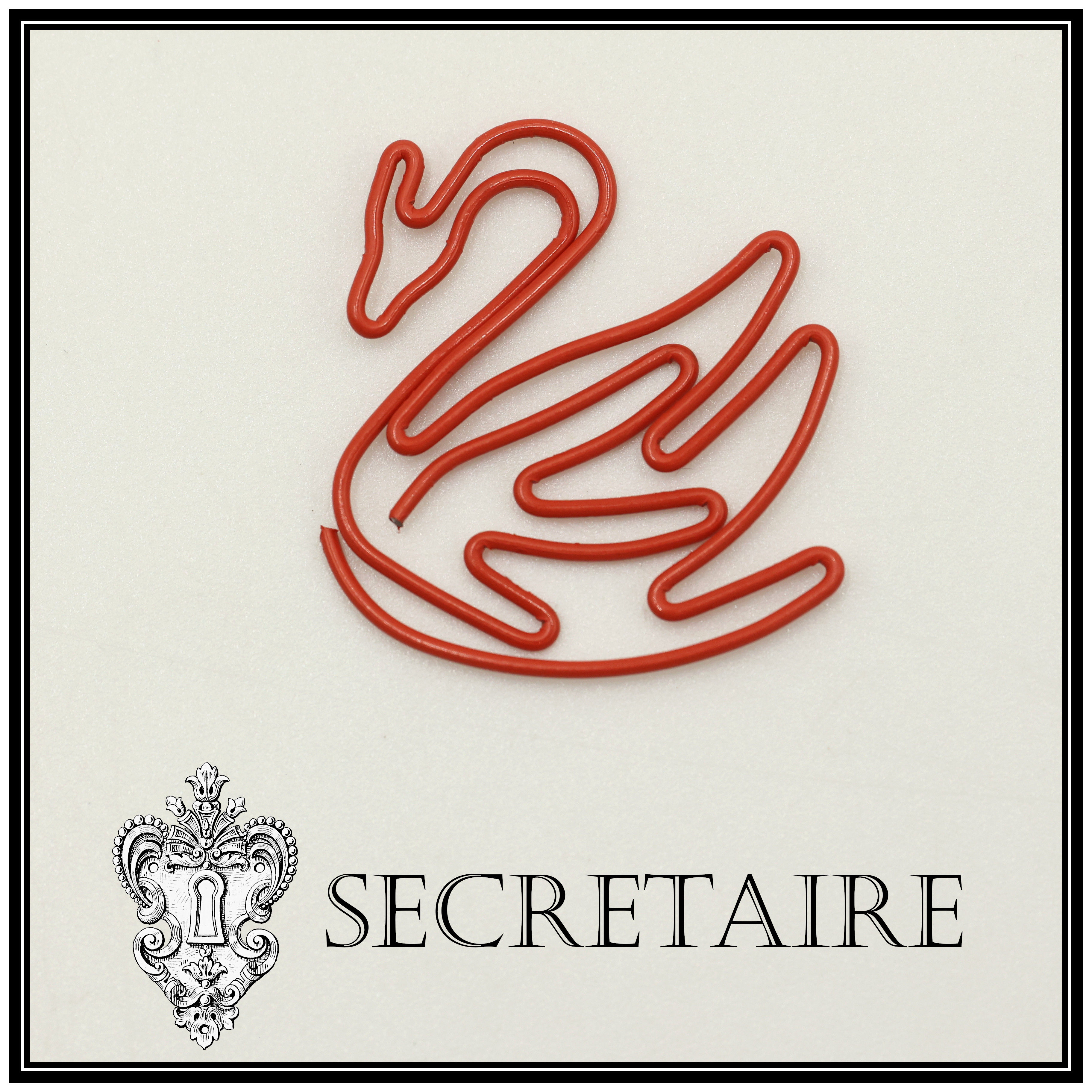 Paperclip: Swan in red plastic coated metal. Size: 3 cm [Y12A]