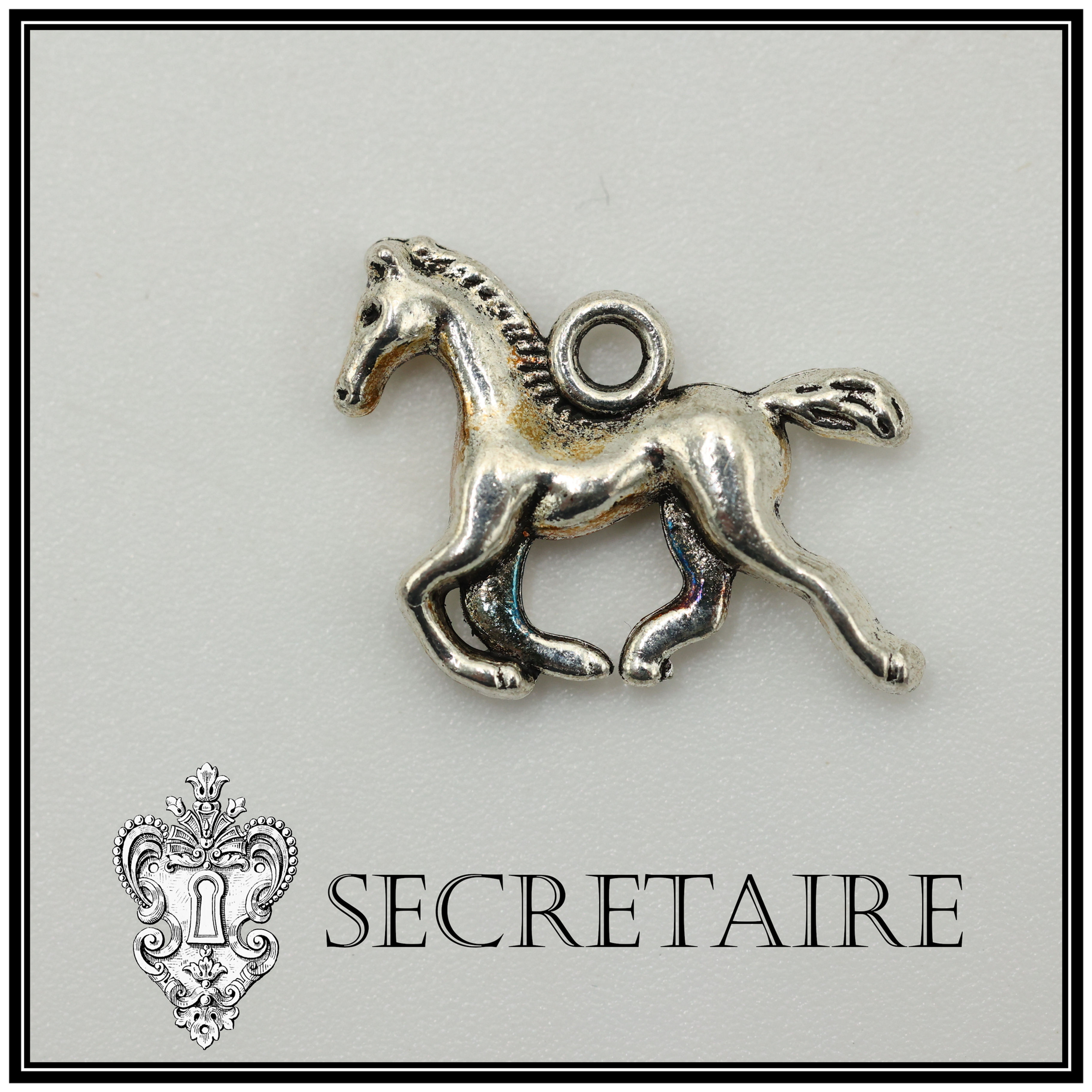 Charm: Horse in silver colour. Size: 1.8 cm [G11]