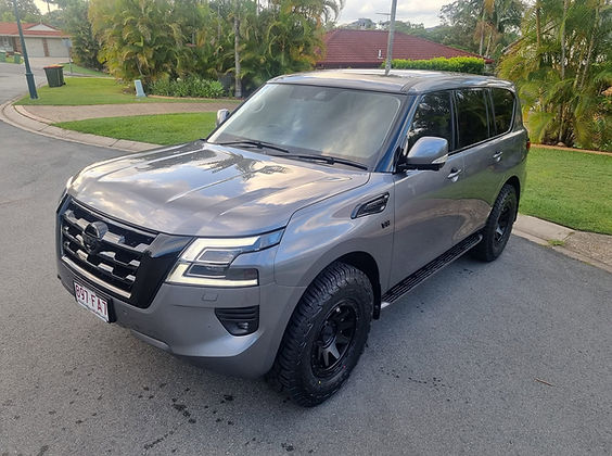 Premium ceramic coating providing durable paint protection on grey Nissan Patrol