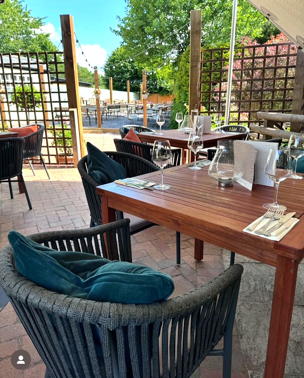 Thumbnail: Padstow Rope Stacking Armchair with Cushion Grey square tables corner close up view