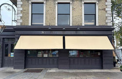 traditional awning london pub beige