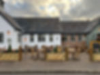 Thumbnail: FSC The front of a country pub showing a mix of timber and rattan dining sets.
