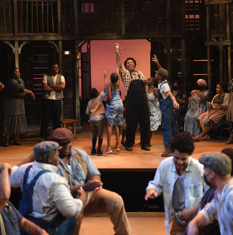 Brandon Bell as Jim with the supernumerary children of Porgy and Bess.JPG