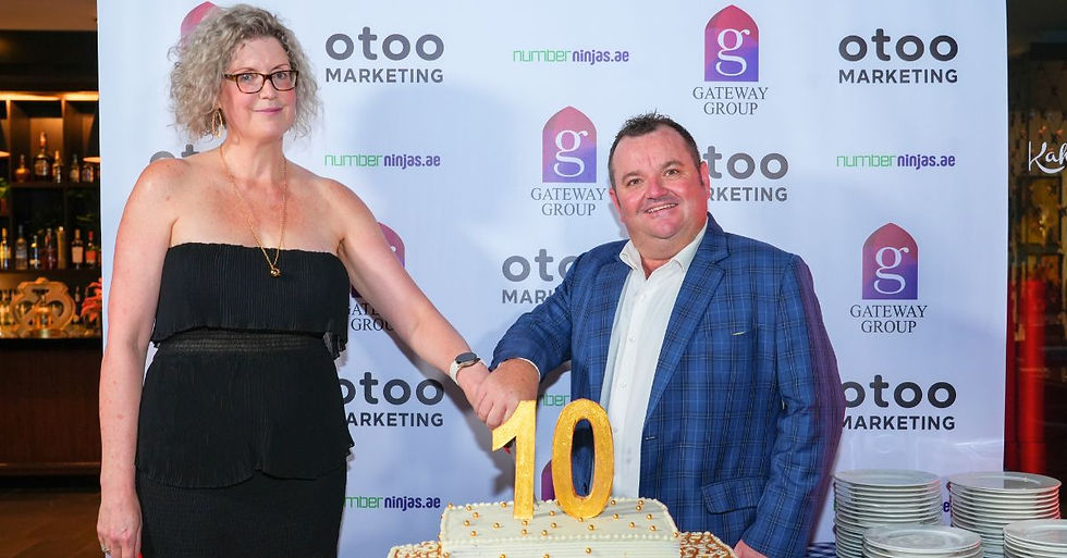 Gateway Group Founder, Jenny Hunt, and CEO, Nathan Hunt, cutting 10th anniversary cake in Abu Dhabi.