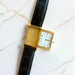 a vintage JLC reverso monoface reference 250.1.08 in yellow gold. features a 23x38mm case, white arabic numeral dial, and black alligator leather strap with a pin buckle. fourfourwatches