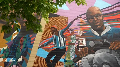 Colorful mural by a local Chicago artist celebrating Black and Brown culture