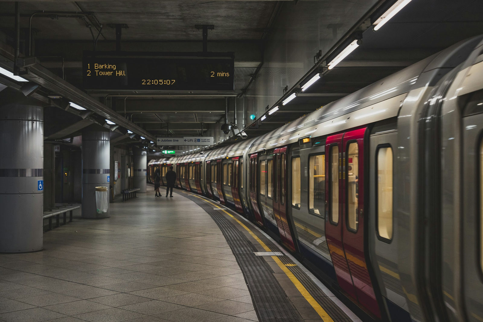 A London Underground train waiting at a station platform