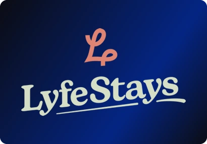 Lyfe Stays logo: A coral ribbon-like L above a soft serif wordmark in sage, underlined with a single stroke.