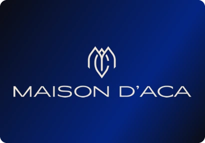 Maison D’ACA logo: A fine-line emblem over a light, widely spaced wordmark.
