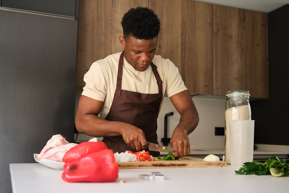 young-black-man-cutting-celery-to-prepare-chicken-2026-03-24-07-45-51-utc.jpg