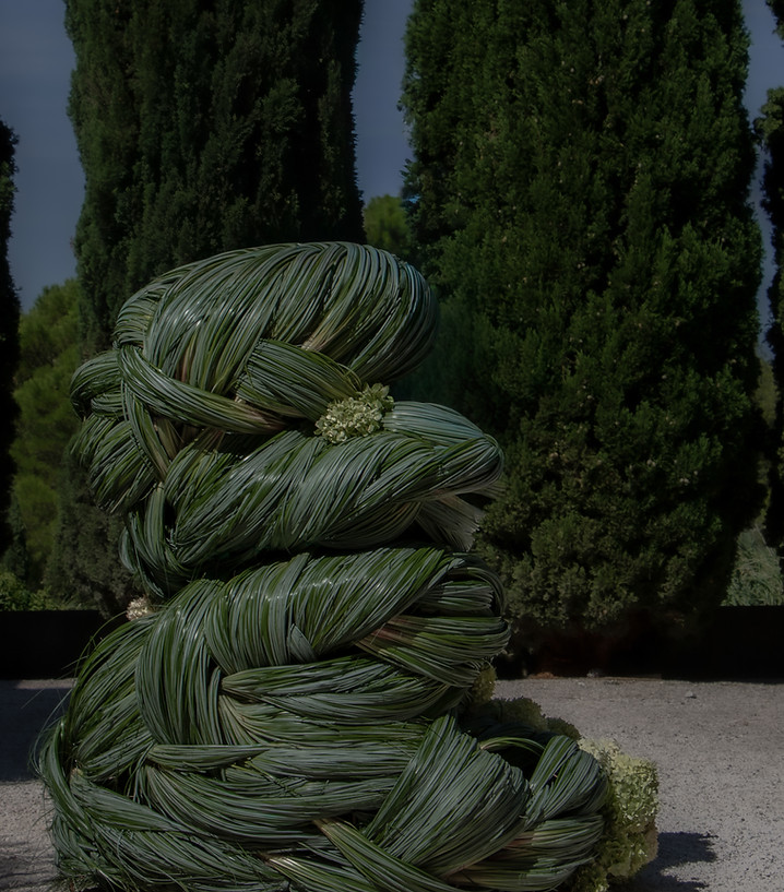 Side view of Carolin Ruggaber of Caro studio sculptural botanical installation, with layered botanical forms
