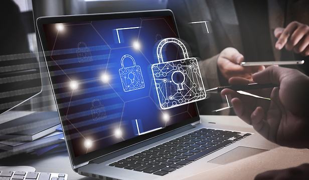 Laptop displaying cybersecurity interface with digital lock and network protection graphics, representing endpoint security a