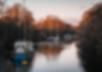 Boats along the river at Lydney Harbour in the Forest of Dean, Gloucestershire