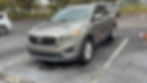 Professional mobile detailing for a clean silver Kia SUV.