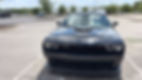Professional mobile detailing for a black Dodge Challenger.