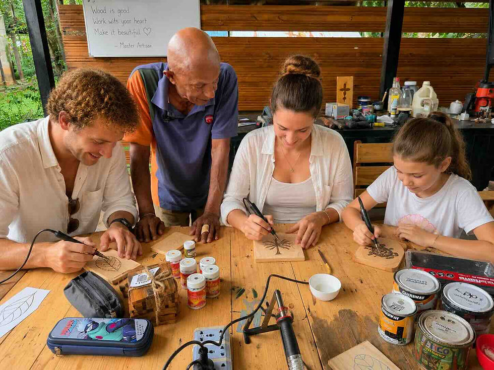 Visitors meeting local wood artisans at Woody Land Artisans in Giriulla Sri Lanka