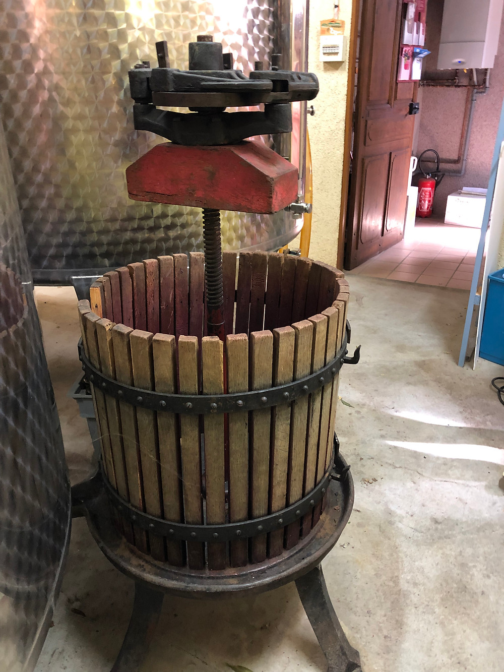 Old manual wine press in Burgundy in Domaine Trapet Rochelandet still in use for producing Gevrey-Chambertin wine from La Petit Chapelle vineyard