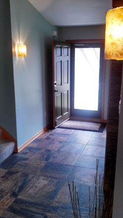 Amber glass sconces in foyer, 2014