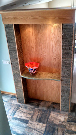 Amber glass shelf in foyer, 2014
