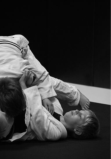 Preschool kids learning Brazilian Jiu Jitsu through fun exercises
