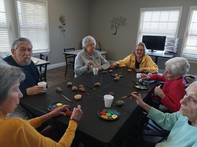 Seniors participating in engaging art and activity programs at Mustang Creek Estates.
