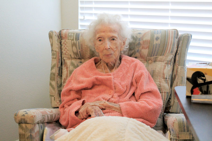 Senior resident Nellie Hoff smiling while sharing memories of her military service during World War II.