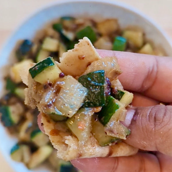 Zucchini is an underrated vegetable in my opinion and often goes unacknowledged in soups and such. I am cooking or rather sautéing it here with onions and a bunch of Indian spices. It makes for an excellent side dish/ accompaniment with daal and rice . You can also eat it with roti or paratha.