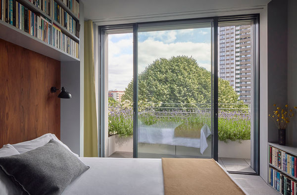 A view of Bedroom at Clerkenwell Rooftop, with lavender planting on the wrap-around terrace outside.