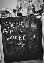 Blackboard in children's nursery saying "You've got a friend in Me!"