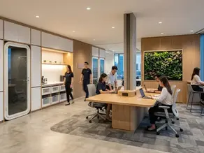 A modern, high-rise Singapore office by Cosmos Decor, demonstrating innovative office interior design. The image highlights a "chaos to cosmos" philosophy with built-in workstations and extensive timber carpentry, showing how an experienced office renovation contractor optimizes real estate efficiency through flexible office renovation.