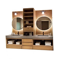 Modern country style double vanity with oak finish and circular mirrors, custom carpentry by Cosmos Decor for master bathrooms.