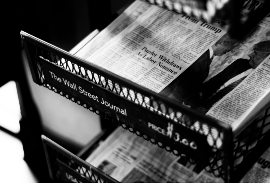 Photo of news papepr stand by Philip Strong on Unsplash