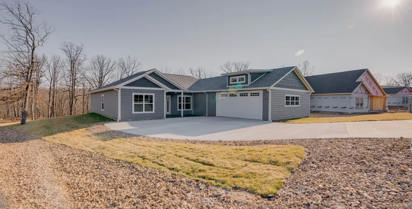 ront exterior of a beautiful custom home in Porto Cima by Cloke Custom Homes, highlighting its modern architecture and curb appeal