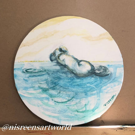 A round canvas watercolour painting depicting a little white dog lying with its back turned, surrounded by abstract blue shapes.