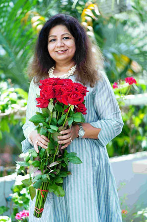 Nandini Kanoria, Co-Founder and Creative Director at Ethereal Celebration Management holding red roses