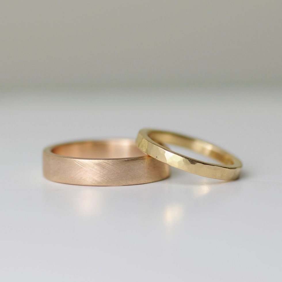 Two rings of rose gold and gold appearance by Rebecca Burt Jewellery.