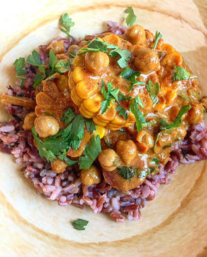 It’s vibrant, inviting, and clearly showcases the texture and richness of the curry served over rice, topped with fresh herbs — perfect for recipe thumbnails and Pinterest/Instagram pins.