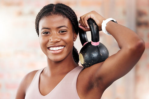 black-woman-face-and-smile-for-kettlebell-exercis-2022-12-29-22-41-22-utc.jpg