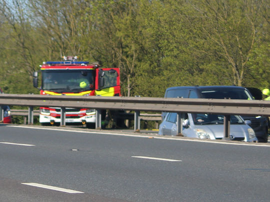 EMERGENCY ON M11: Firefighters deal with car fire on busy motorway near Harlow Essex