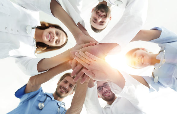 bottom view.a team of doctors at the medical center clasped thei.jpg