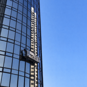 A window cleaner cleaning a high rise building