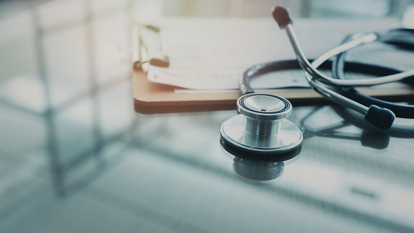 Medical data and stethoscope on table.jpg