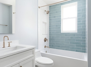 Bathroom with patterned floor tiles, aqua blue subway tile tub surround, and brushed nickel fixtures.