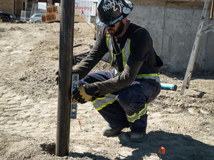 Screw Pile Calgary worker